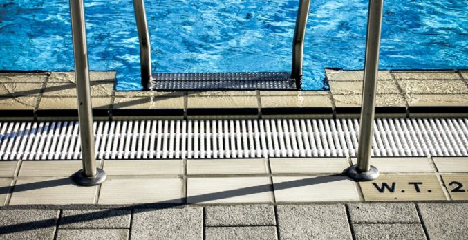 A closeup look of a pool railing