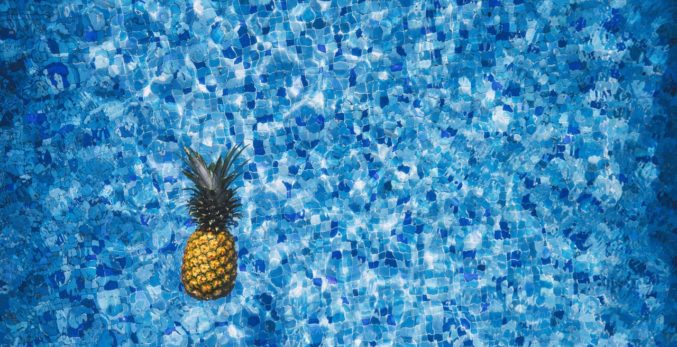 A swimming pool with a pineapple in it