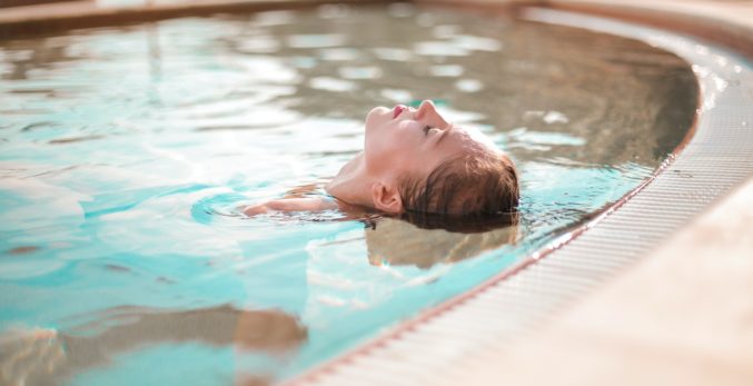 A closeup look of a woman in the pool
