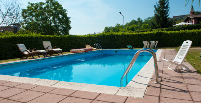 A large pool in the garden of a house